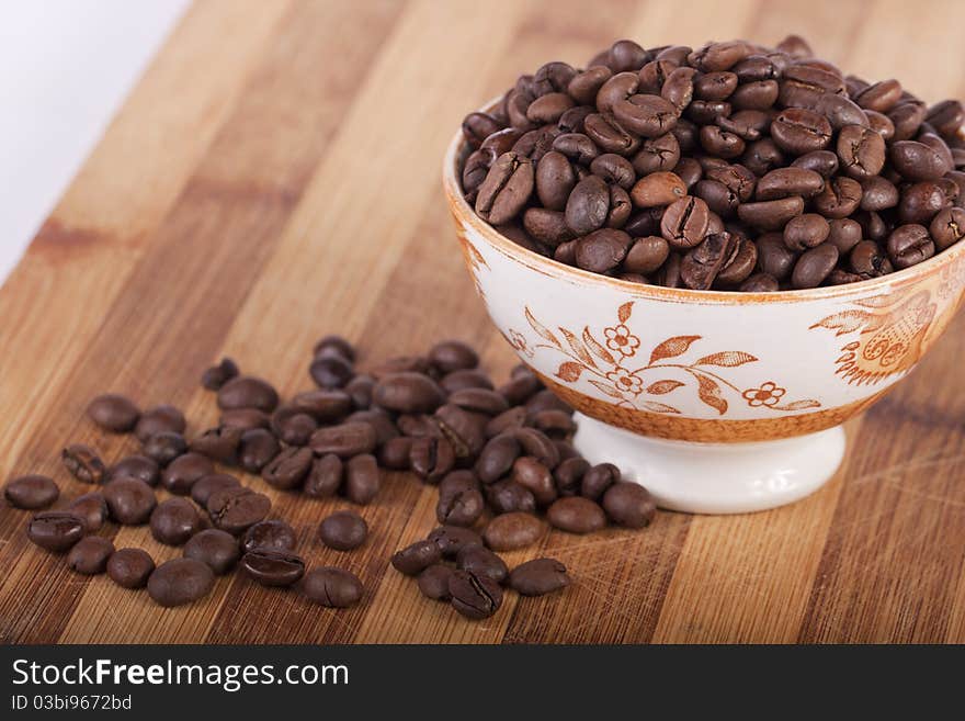 Beans of coffee on a bowl