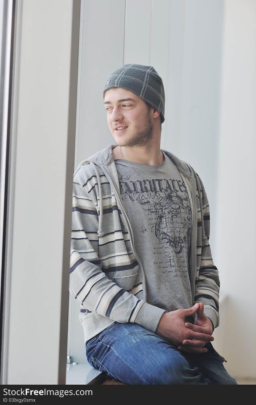 Happy young man in fashion clothing posing. Happy young man in fashion clothing posing