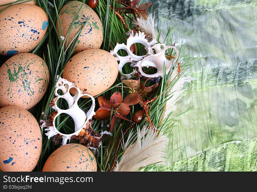 Easter wreath with eggs and decorations on green cloth