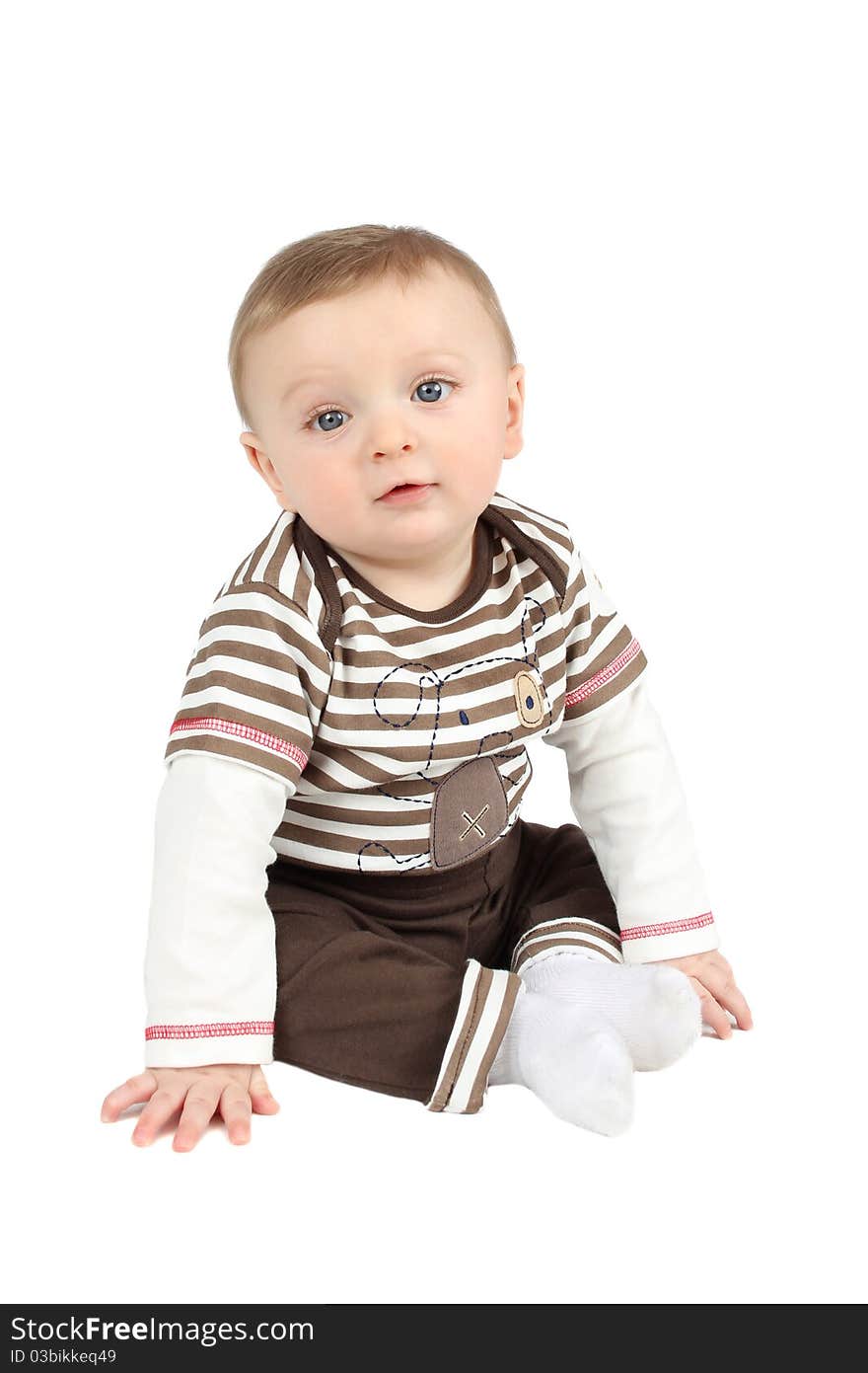 Cute baby boy sitting against a white background. Cute baby boy sitting against a white background