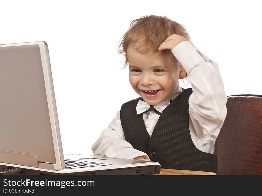 Little child and laptop. Isolated on white background