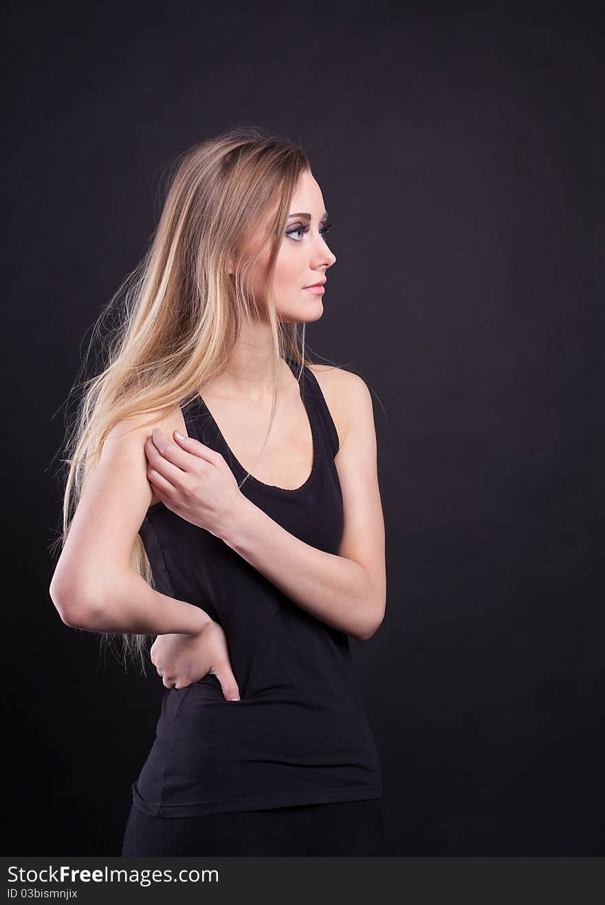 Young Tall Blond Girl In Black Tank Top