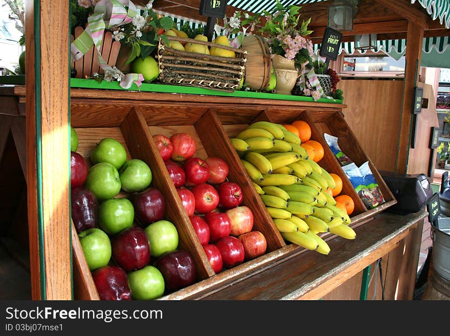 A cart full of fruits for sale. A cart full of fruits for sale