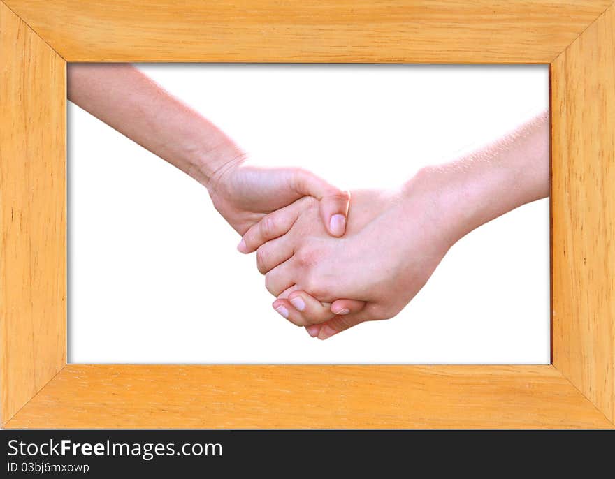 Holding hands in wood frame isolated on white background