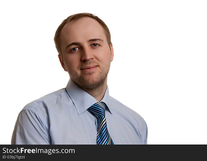 Portrait of an unshaven businessman in a gray suit with a white background