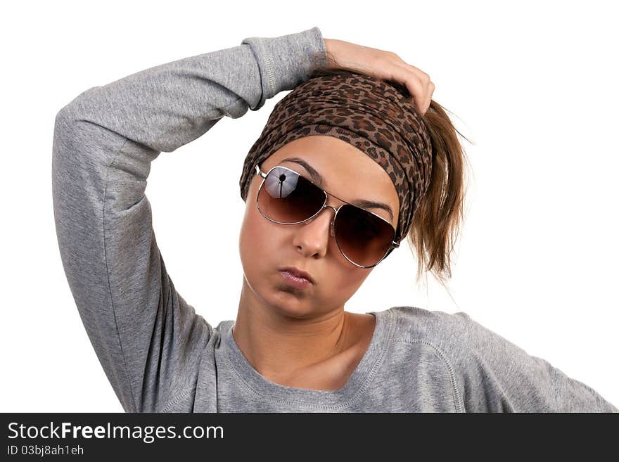 Portrait of a girl with glasses in a leopard scarf on a white background