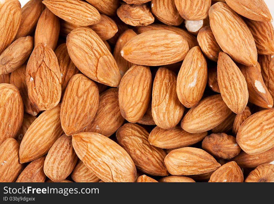 Background of fresh dry fresh brown almonds