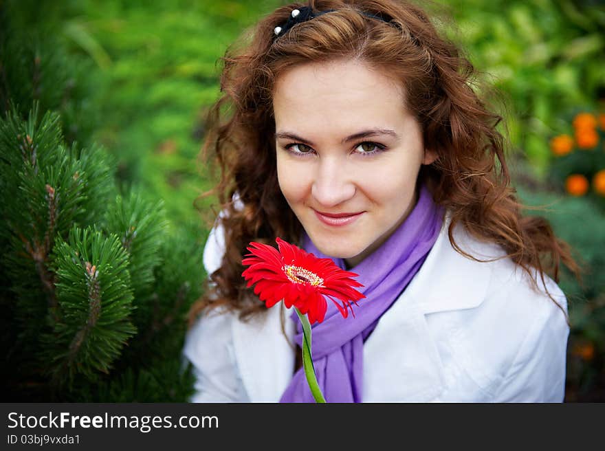 Young Woman With Red Flower Gerbera