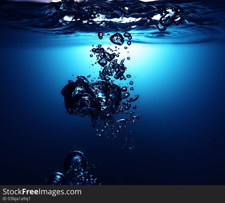 A blue fresh water with bubbles background