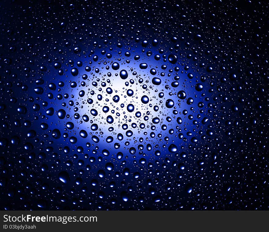 Round water drops on blue background close-up. Round water drops on blue background close-up