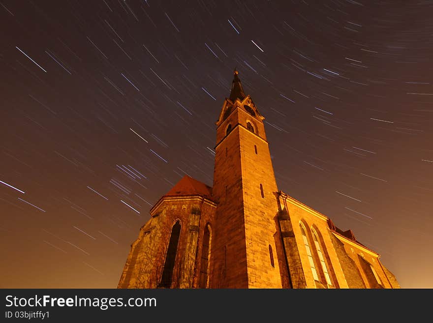 Old church and moving stars at night. Old church and moving stars at night