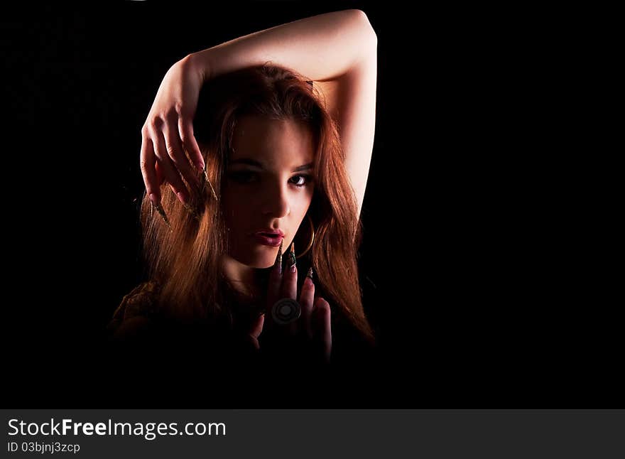 Beautiful young longhair brunette in a romantic pose. Beautiful young longhair brunette in a romantic pose