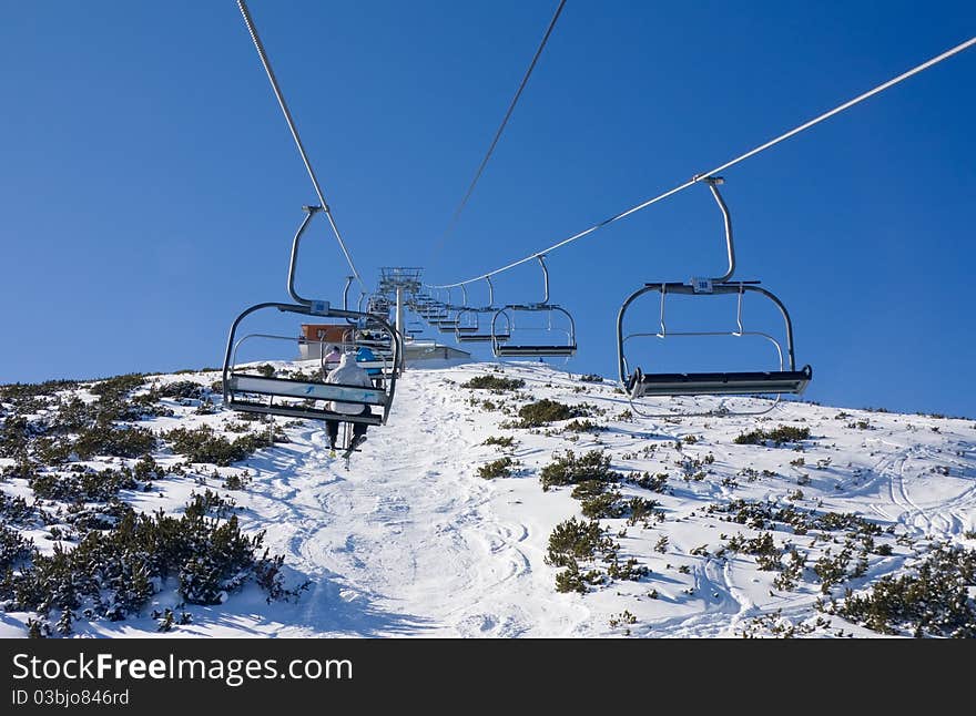 Chair ski lift over mountain landscape