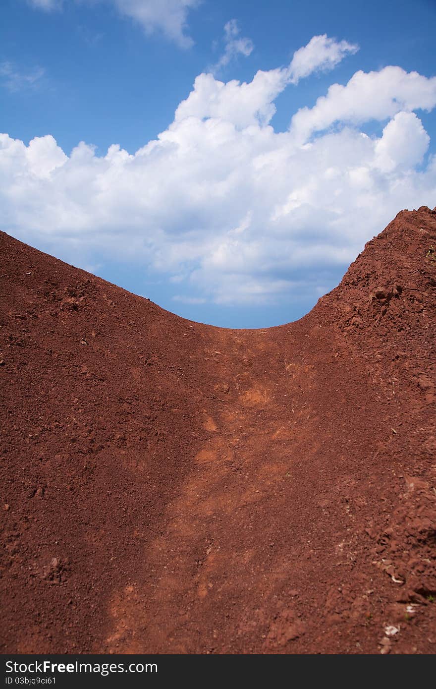 Clouds over red mountain