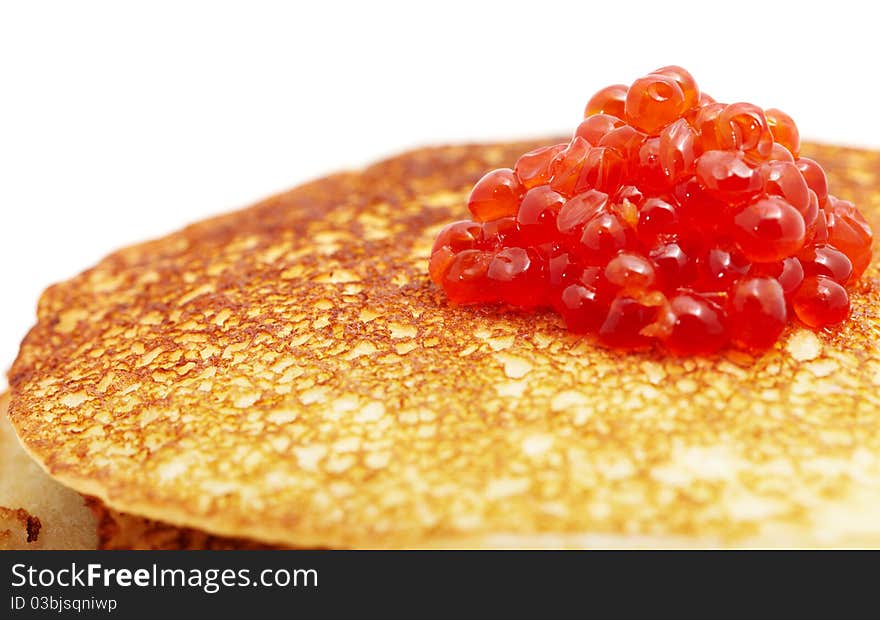 Studio photography of a pancakes with caviar close up macro with unfocused background. Russian traditional food for the holidays (maslenitsa)