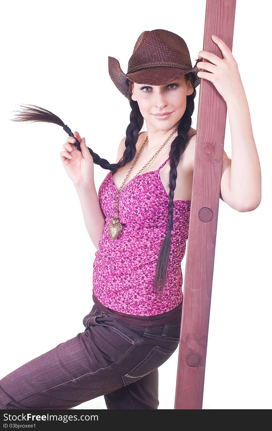 Lovely young girl the cowboy with a ladder on a white background close up. Lovely young girl the cowboy with a ladder on a white background close up