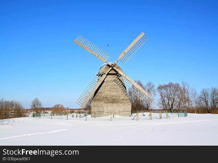 Aging rural mill on snow field