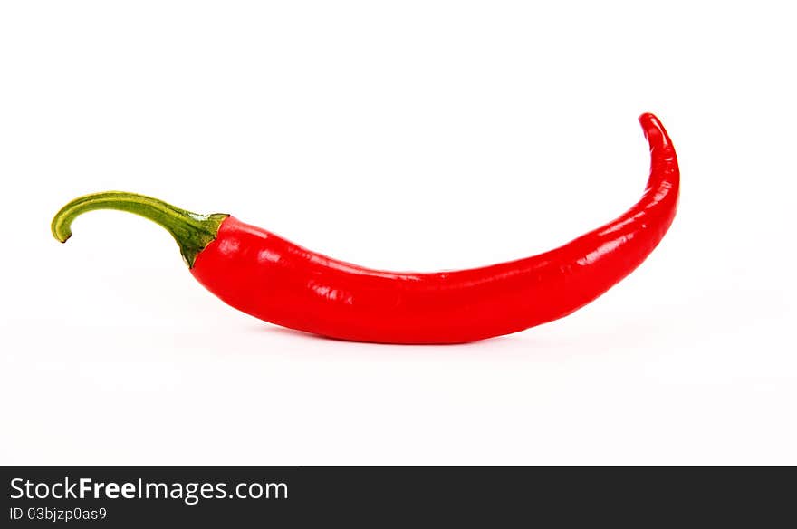 Studio photo of red chili pepper on white background