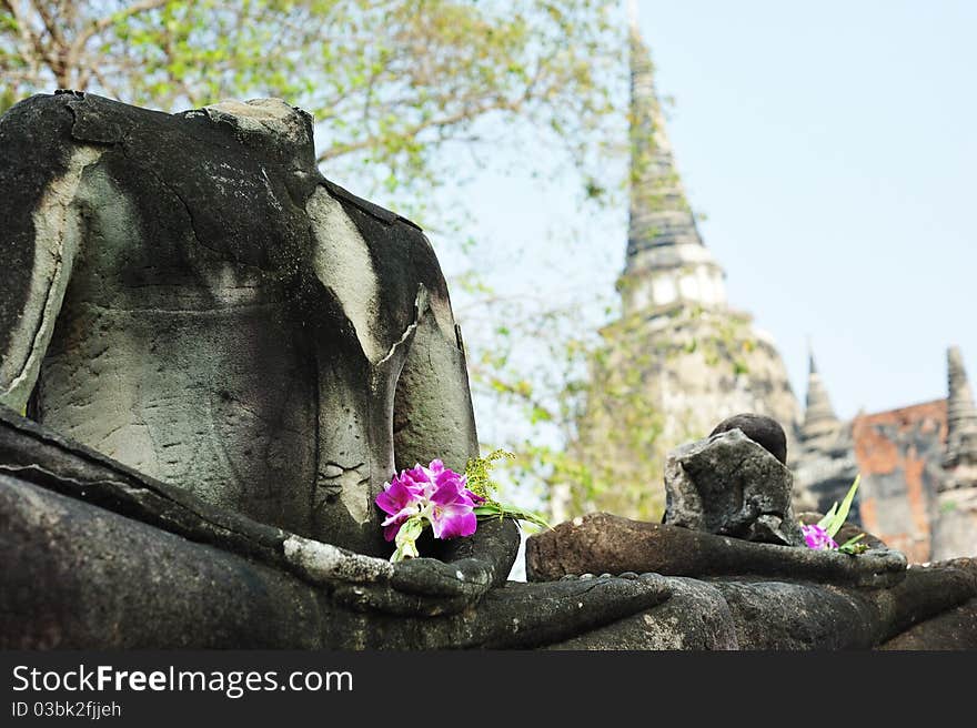 Ruin buddha with flower in wat phrasisunpeth ayutthaya thailand. Ruin buddha with flower in wat phrasisunpeth ayutthaya thailand