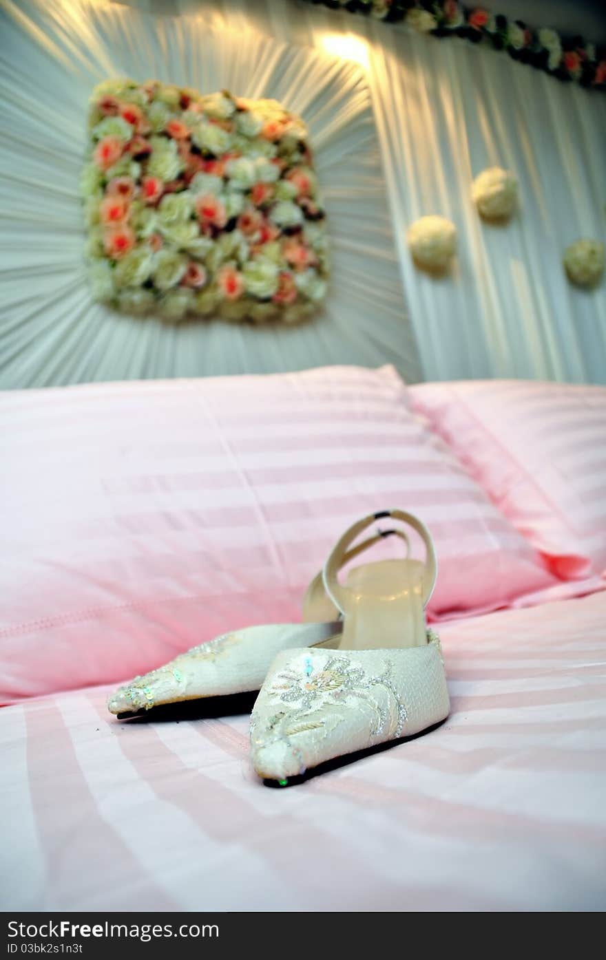 Pair of high heel white bridal shoes