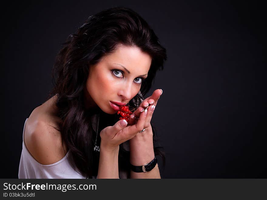 Sexy girl with a branch of viburnum in her hands