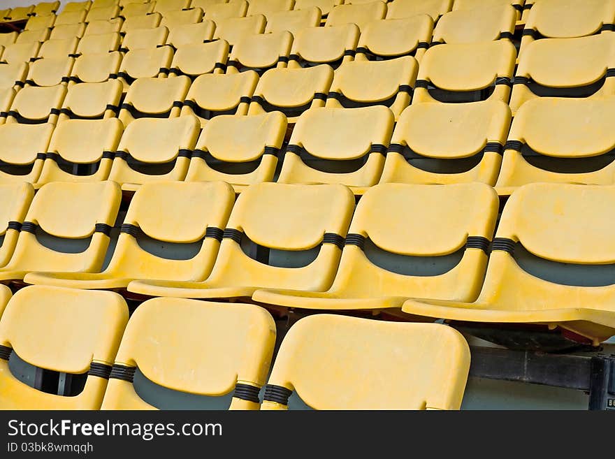 Yellow Seat Pattern in Football Stadium