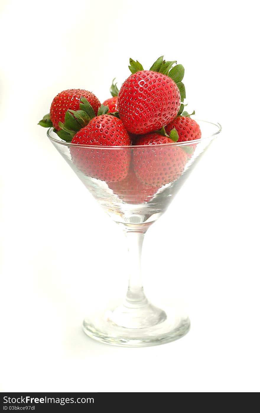 Strawberries in wine glass on white. Strawberries in wine glass on white.