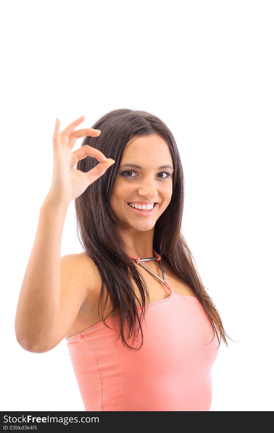 Portrait of a cute female showing an OK sign isolated over white background