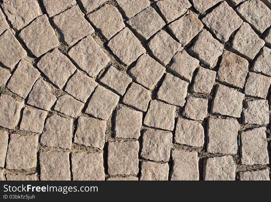 A portion of the street, covered with setts. Shot from above. A portion of the street, covered with setts. Shot from above.