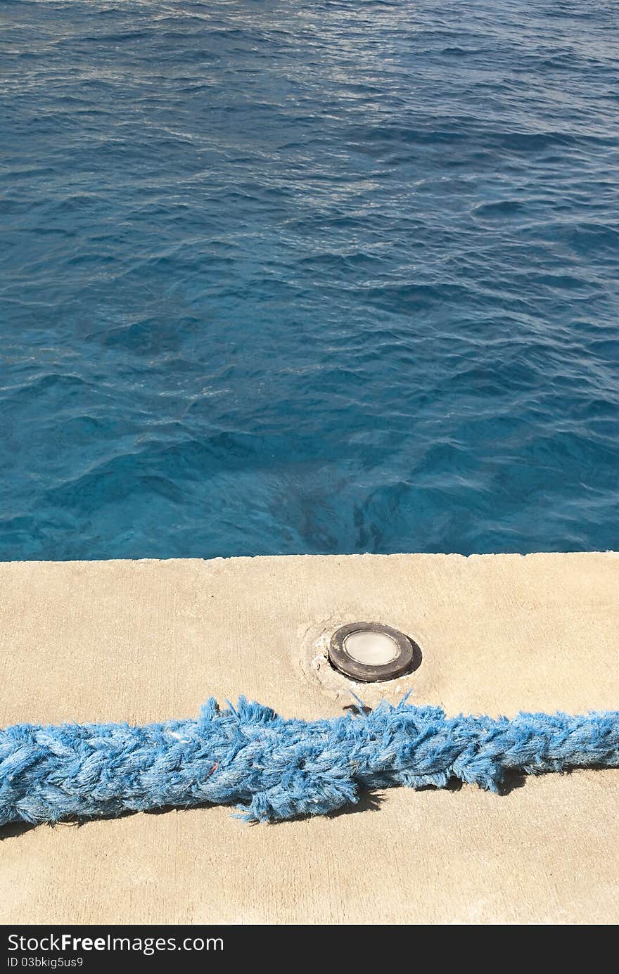 Rope for a cruise´s anchor, laying at a peer. Rope for a cruise´s anchor, laying at a peer