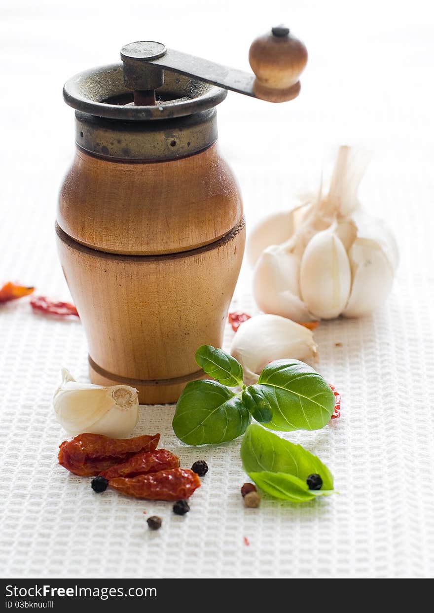 Garlic, pepper, basil on kitchen towel. Garlic, pepper, basil on kitchen towel