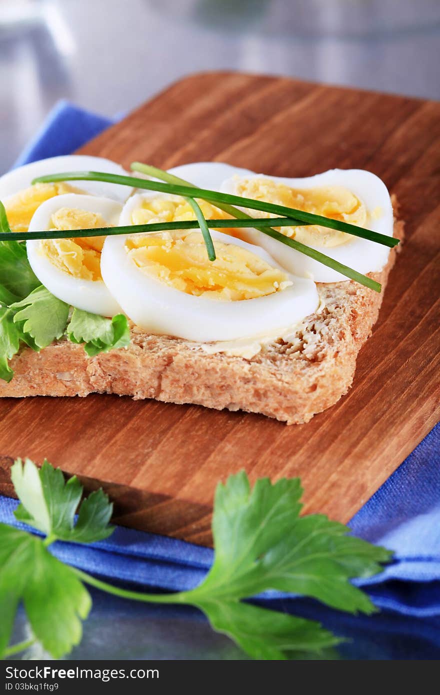 Whole grain bread with slices of boiled egg. Whole grain bread with slices of boiled egg