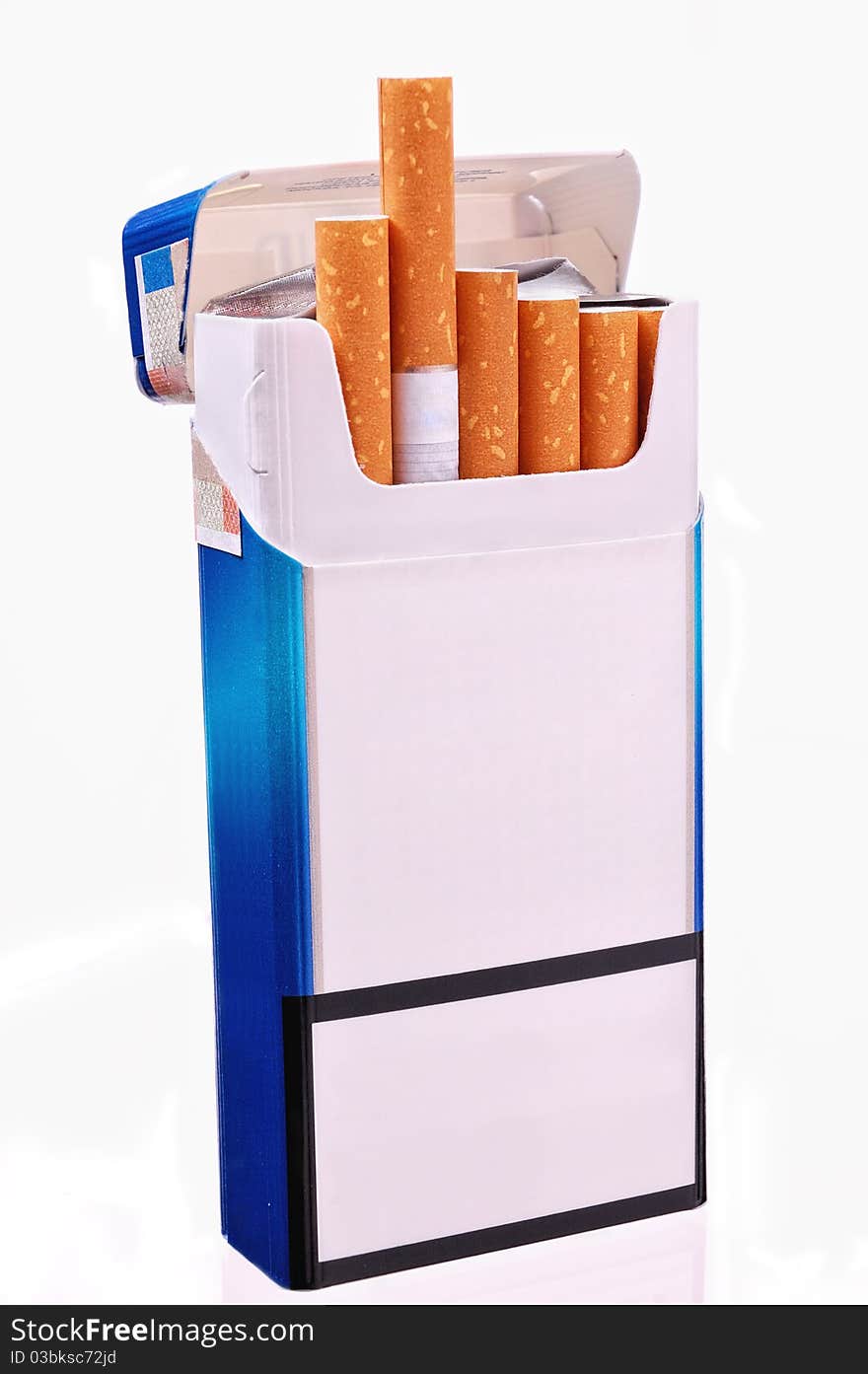 Open pack of cigarettes on a light background