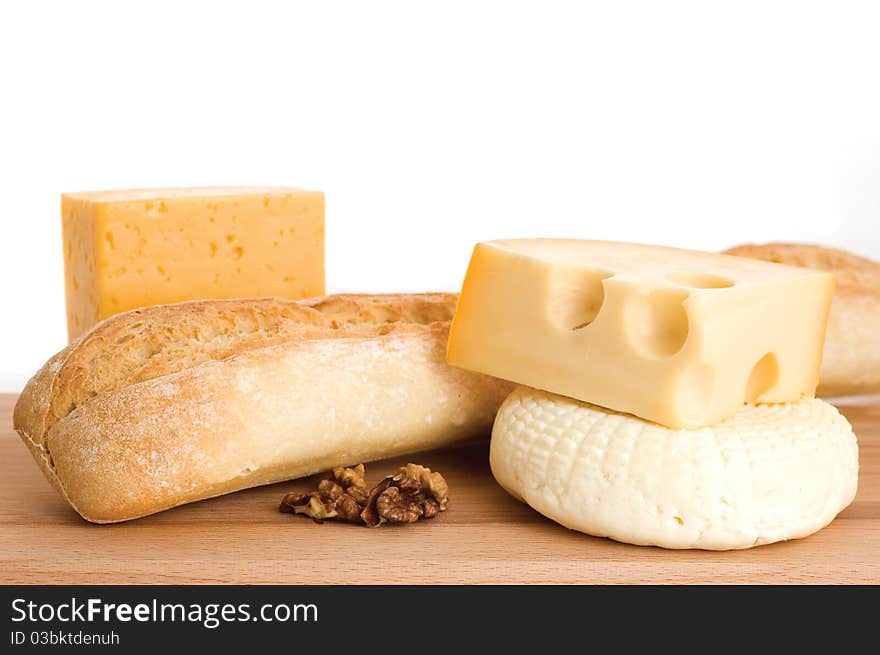 Collection of cheeses and french bread. Collection of cheeses and french bread