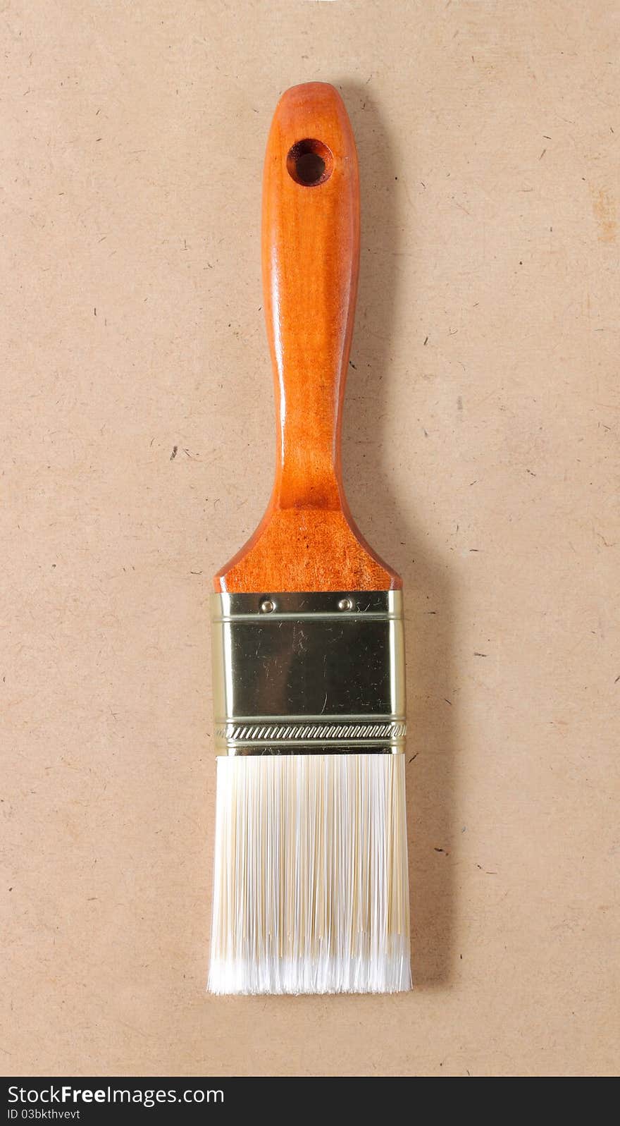 New wooden paint brush on wooden table