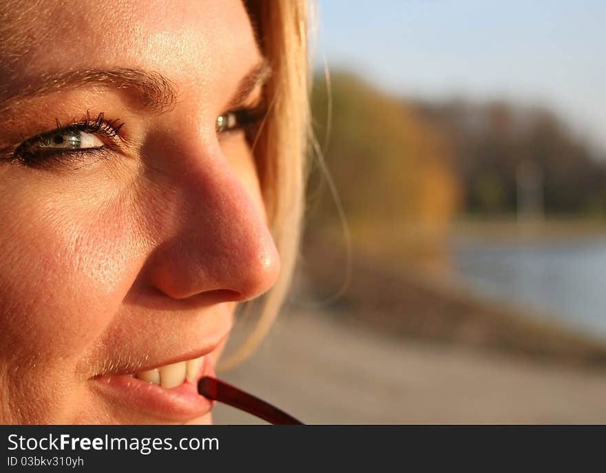 Beautiful blond girl in the sunset light