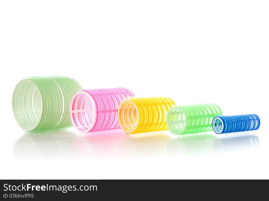 Multicolored hair curlers isolated over white background. Multicolored hair curlers isolated over white background