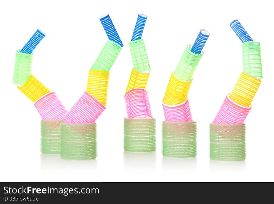 Multicolored hair curlers isolated over white background. Multicolored hair curlers isolated over white background