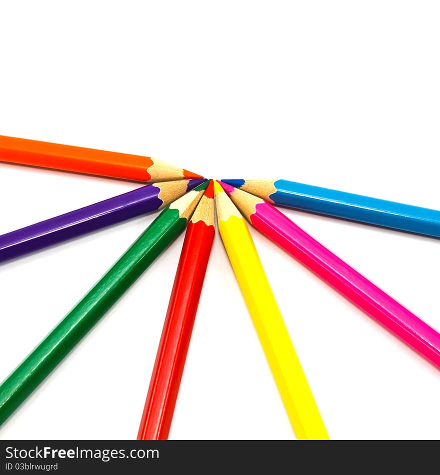 Assortment of coloured pencils on white background. Assortment of coloured pencils on white background