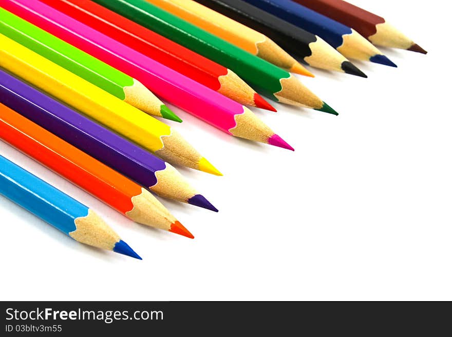 Assortment of coloured pencils on white background. Assortment of coloured pencils on white background