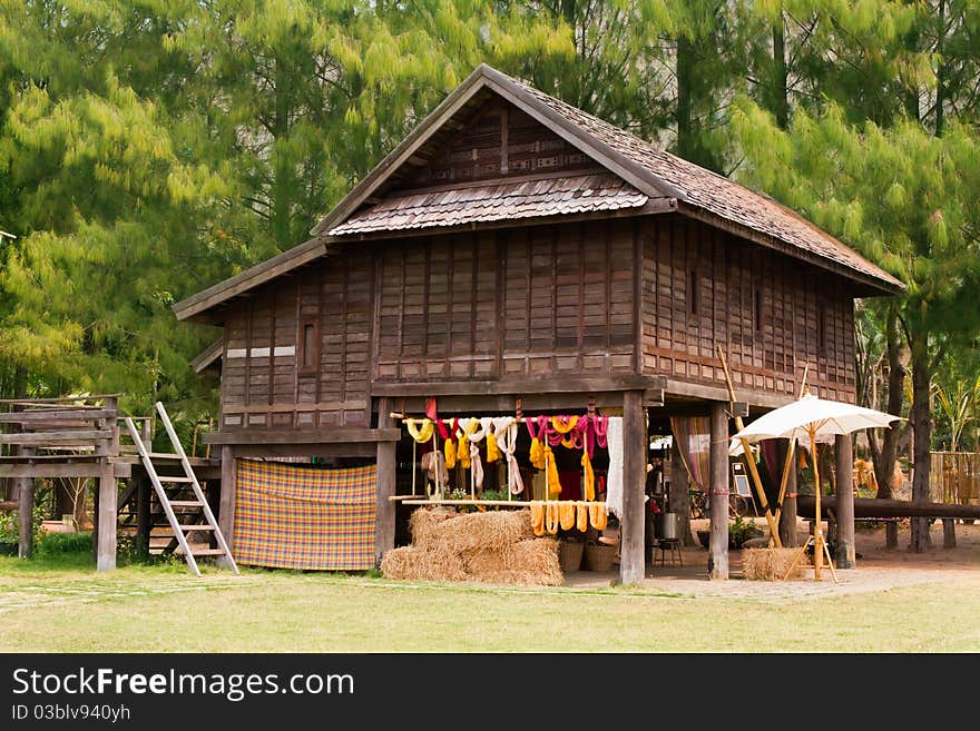 Asian old hut with green tree