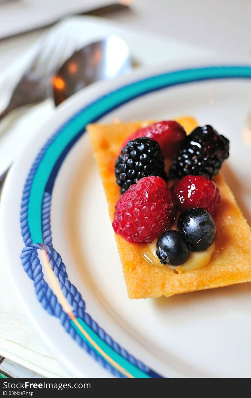 Freshly baked delicious fruit tart made with berries. Freshly baked delicious fruit tart made with berries.