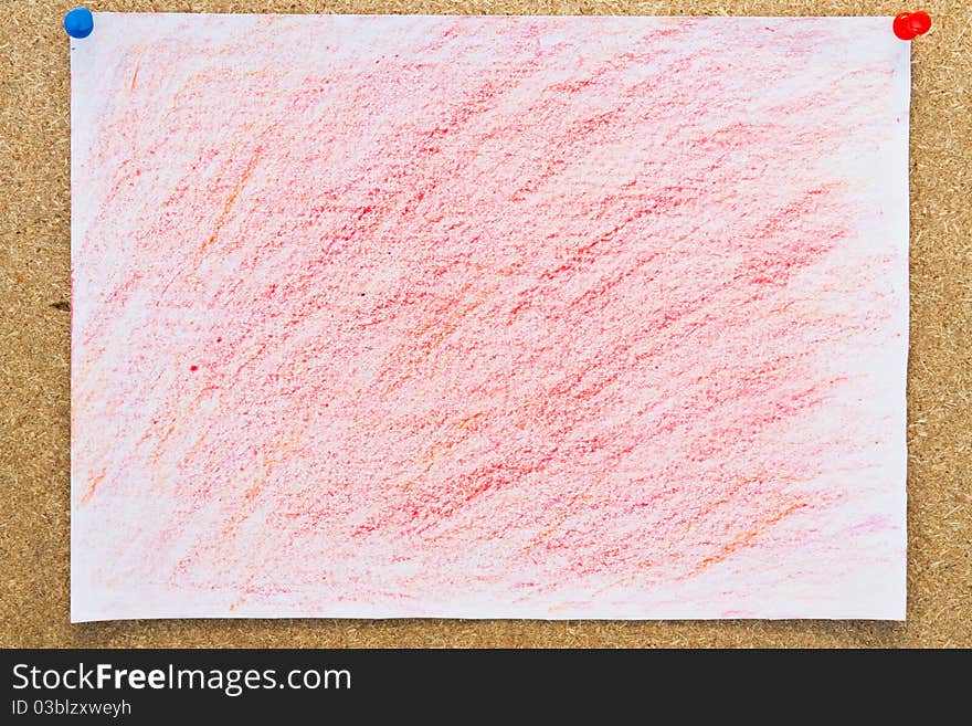 Red crayon pained on paper and peg on board