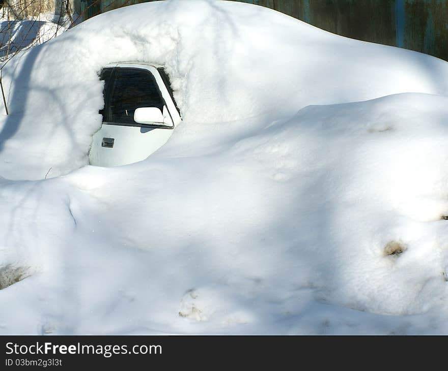 The car under the snow.