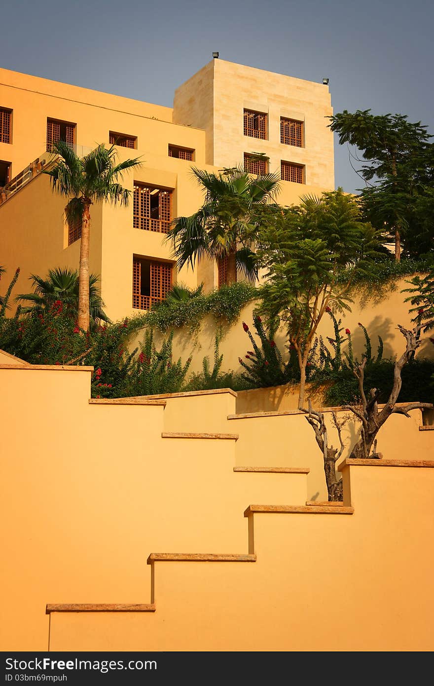 Geometry of a hotel building in a resort by the Dead Sea at the time of sunset. Geometry of a hotel building in a resort by the Dead Sea at the time of sunset.