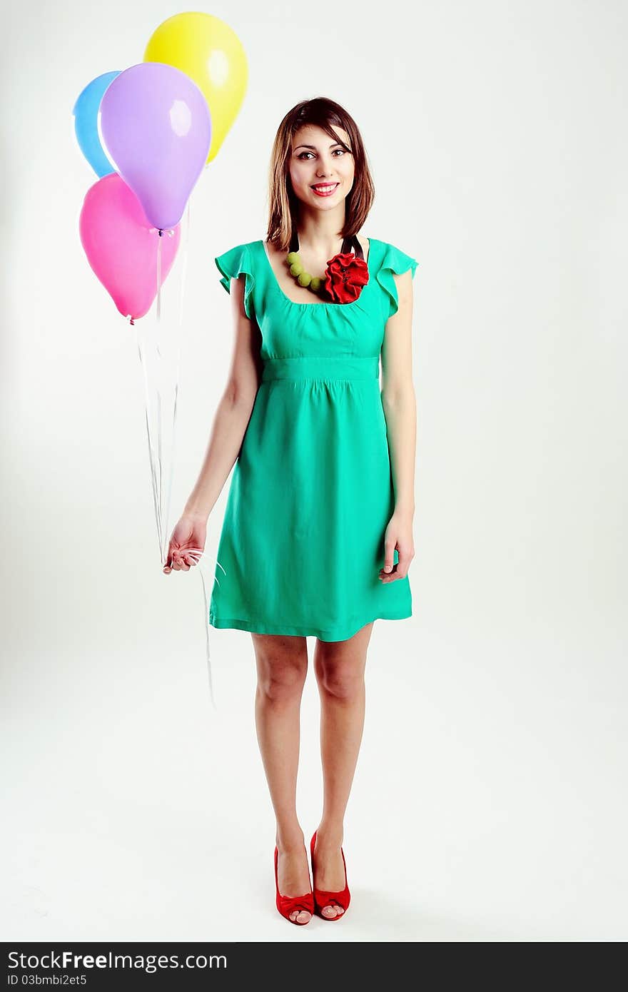 An image of young woman with birthday balloons. An image of young woman with birthday balloons