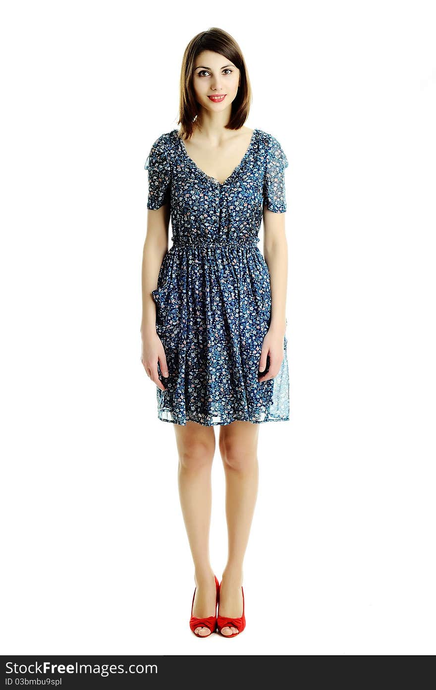 A girl in a dress with a floral pattern. A girl in a dress with a floral pattern