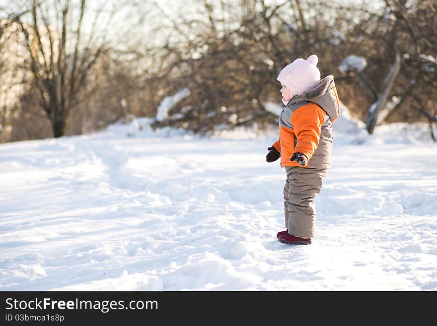 Adorable baby stay on road winter park