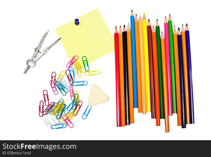 An image of pencils with clips and sheet of paper. An image of pencils with clips and sheet of paper