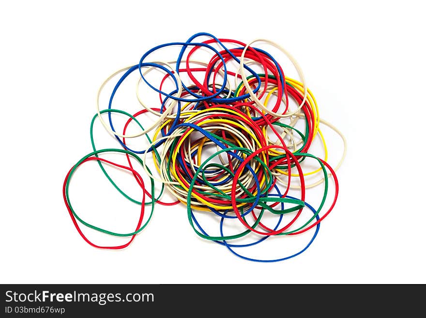 A pile of color rubber bands on a white background.